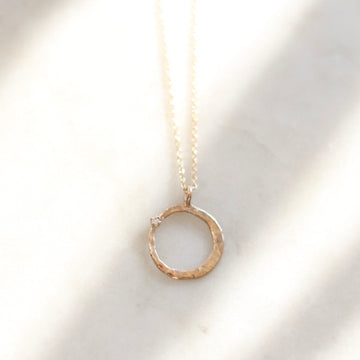 Crescent Hugs a Diamond Necklace